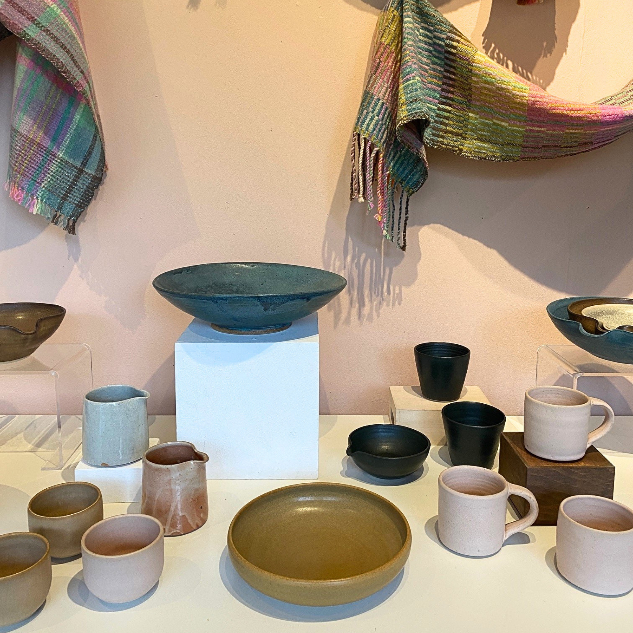 Image of ceramics and scarves displayed in the Craft Gallery