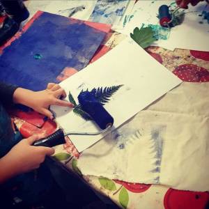 child painting at the Burton Arts Lab