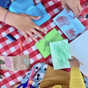 children hands on table at Burton Art Gallery Arts Lab