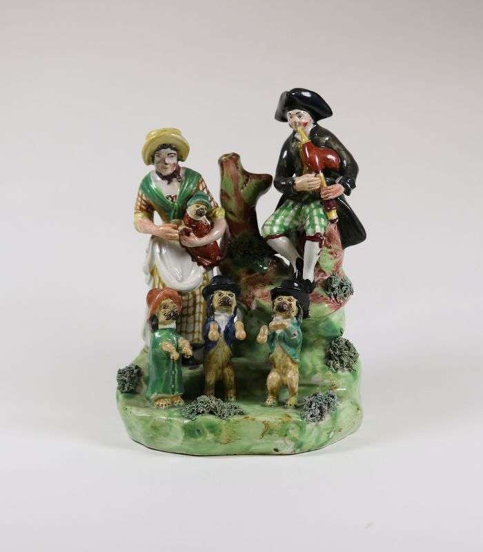 Staffordshire Ware figurine of man, woman and clothed dancing dogs - part of the decorative arts collection