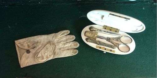 Minature glove including items to mend gloves Photographs by kind permission of Claire Cunnington.