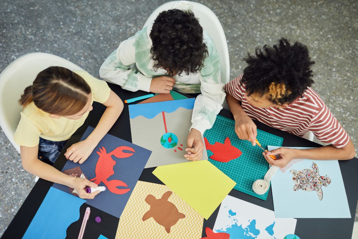 Image shows three young people doing art activities