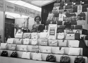 Black and white photograph of leather stall with ladies handbags
