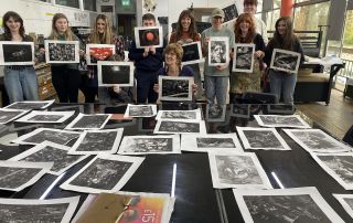 Artist Emma Stibbon and BYC members show off their monoprints