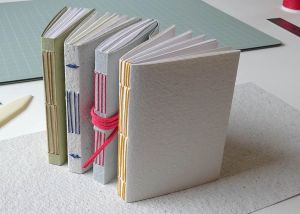 Image shows four handmade books