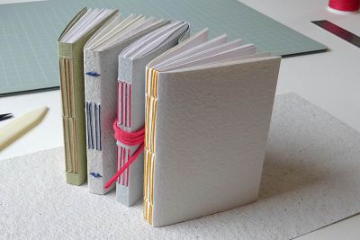 Image shows four handmade books
