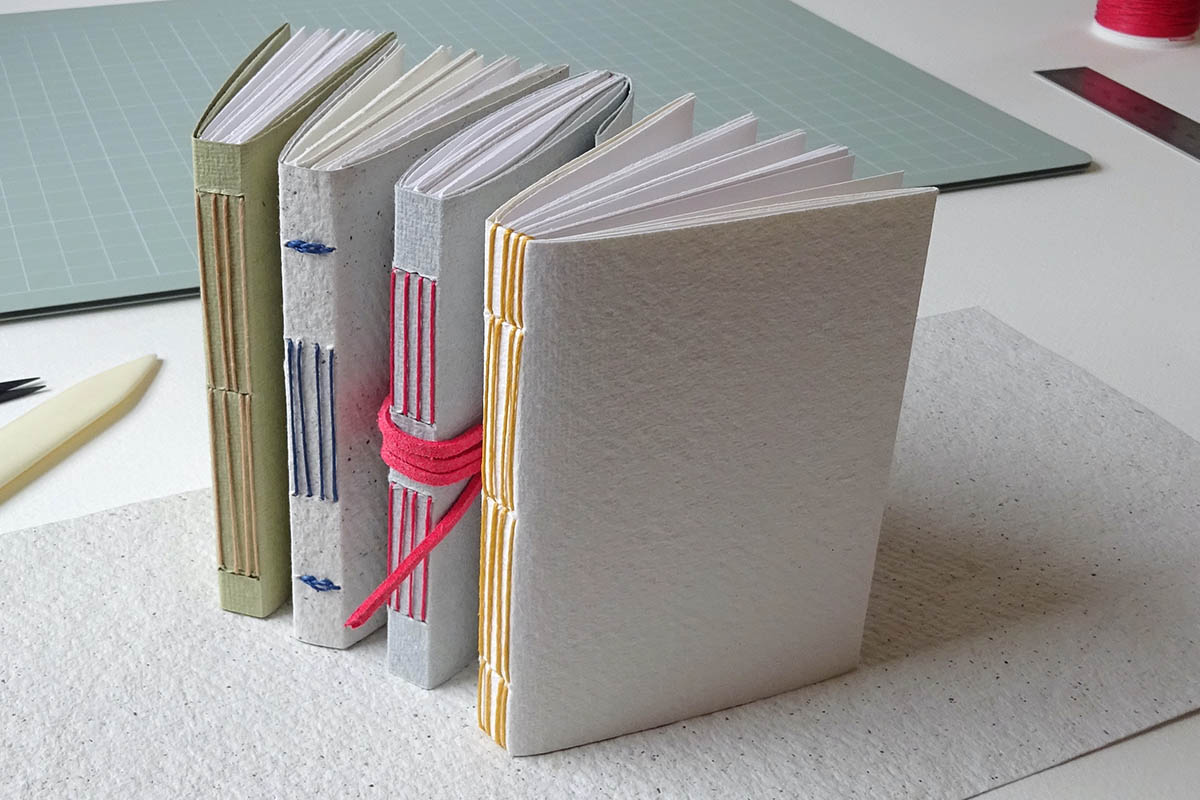 Image shows four handmade books